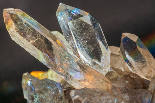istock natural clear quartz crystal cluster closeup in prism light 2155757977