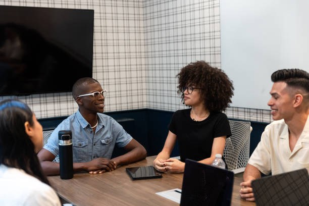 istock Successful Diverse group of Business Professionals Meet in Office around Table 2155758441