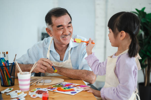 istock Legacy of Colors: Grandfather and Granddaughter's Art Sessions 2155761041