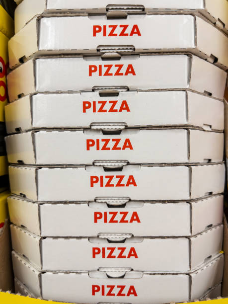 istock Stacks of Delivery Pizza Boxes in Kitchen 2155761905