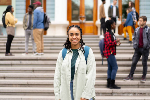 istock A college student standing outside the building 2155774620