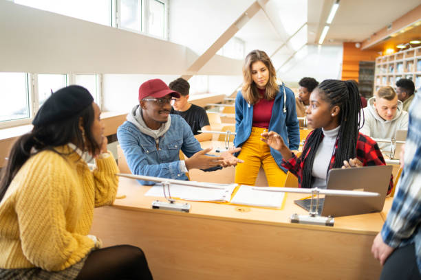 istock Scholars gathered around to share their views 2155774625