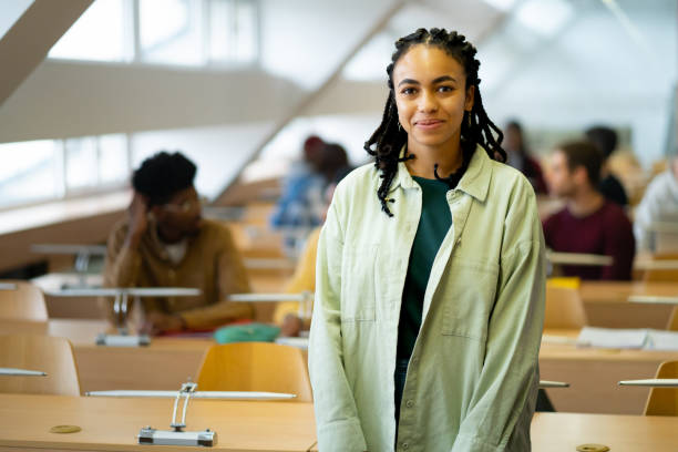 istock Portrait of pretty female student standing in classroom 2155774638