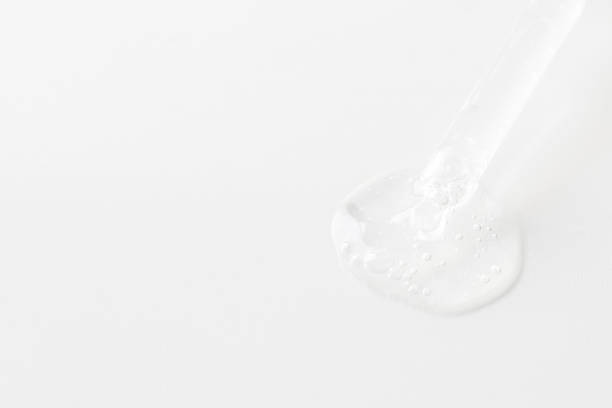 istock Pippete with trasparent liquid and smear at white background for cosmetic,medicine, labaratory test and pharmacy concept. 2155774870