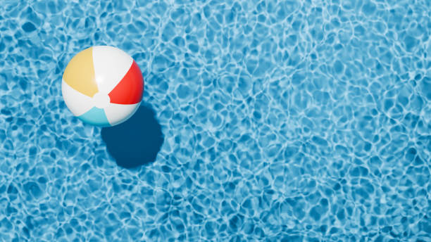 istock Summer holidays banner. Swimming pool top view. Beach ball in the empty clear pool. 2155774925