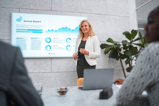 istock Data-Driven Leadership by Mature Businesswoman in a Modern Boardroom 2155777760