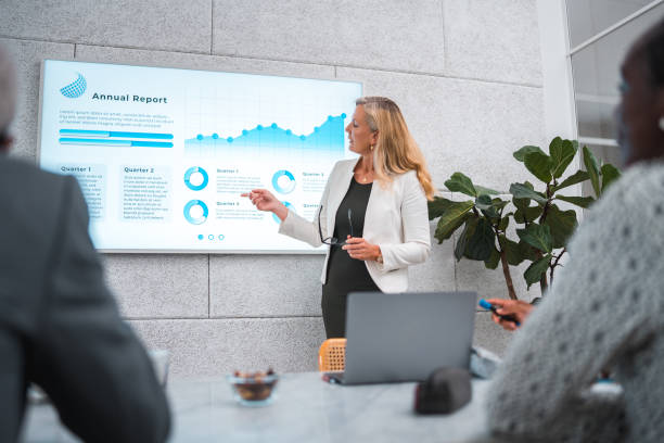 istock Mature Businesswoman's Expert Presentation in a Modern Boardroom 2155777761