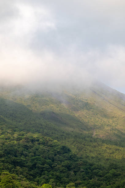 istock Clouds over the Arenal Volcano in Costa Rica 2155778341