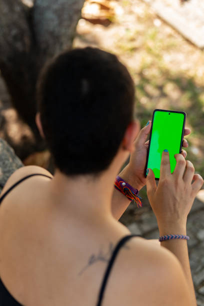 istock A young woman interacting with her phone 2155782378