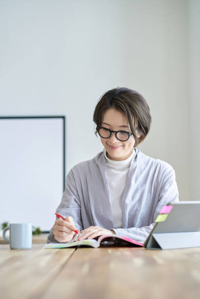 istock A woman working in a room 2155784531