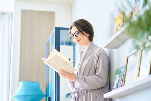 istock woman reading in the room 2155784664