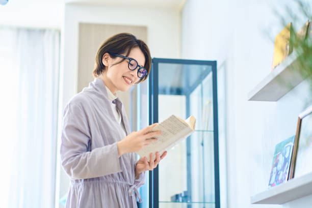 istock woman reading in the room 2155784671