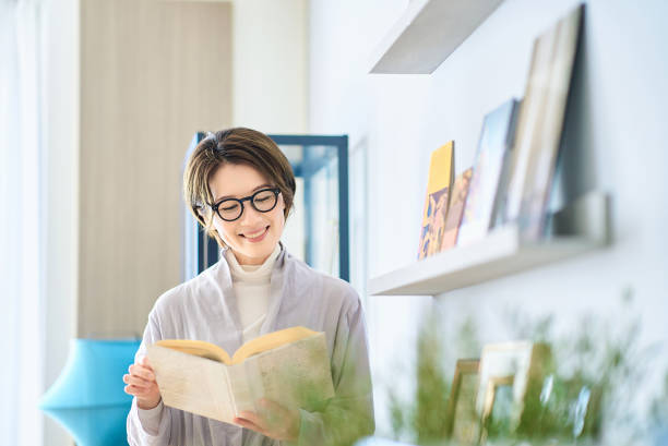istock woman reading in the room 2155784684
