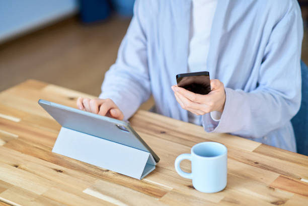 istock A woman operating a tablet PC and smartphone 2155785771