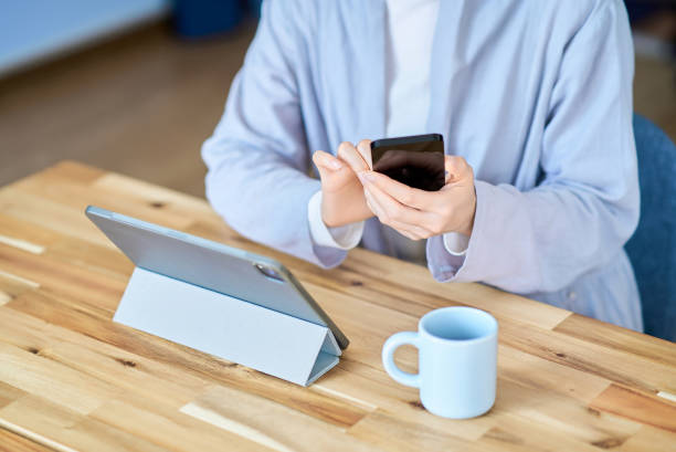 istock A woman operating a tablet PC and smartphone 2155785776