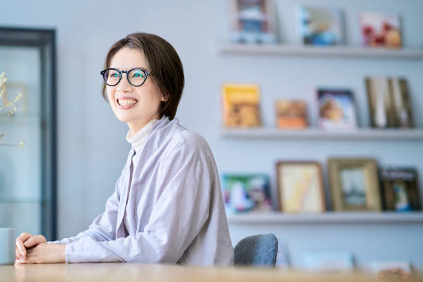 istock A woman smiling in the morning light 2155785833