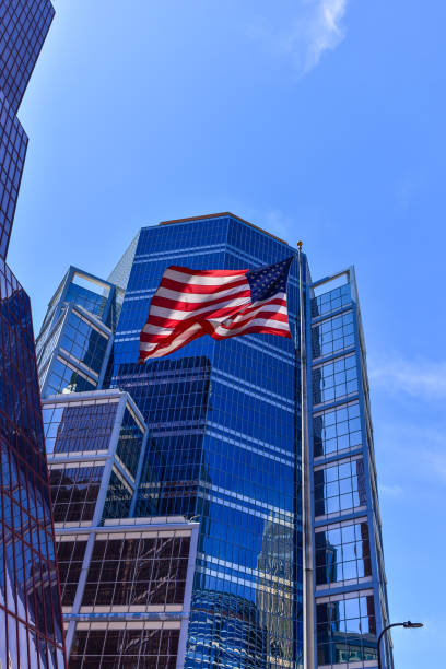 istock American Flag and Modern City Skyscrapers 2155786013