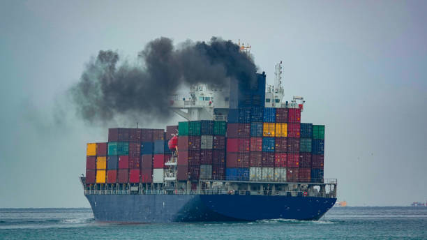 istock Smoke exhaust gas emissions carbon dioxide from cargo lagre ship container ship,Marine diesel engine exhaust gas from combustion, Gas Emission Air Pollution from transportation. green house effect Eco 2155787985