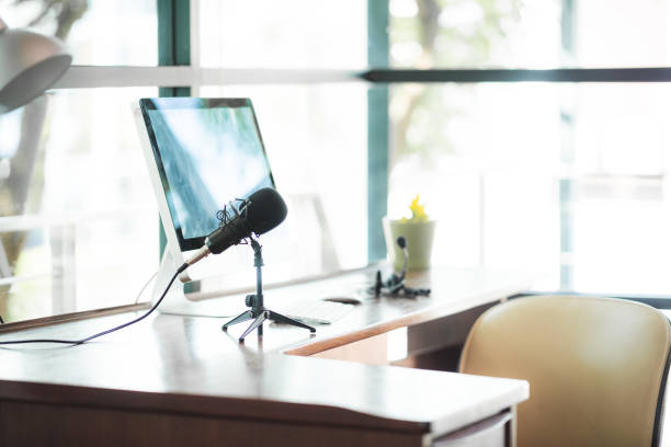 istock Concept of podcast, broadcasting or recording home studio room with microphone and notebook or laptop, audio, song and sound recording, indoor radio practice room, hobby and wellbeing at home. 2155788505