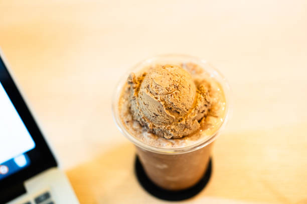 Intense milk chocolate gelato with whipped cream and chocolate nibs