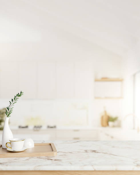 istock A space for displaying products on a white marble kitchen countertop in a minimalist white kitchen. 2155791559