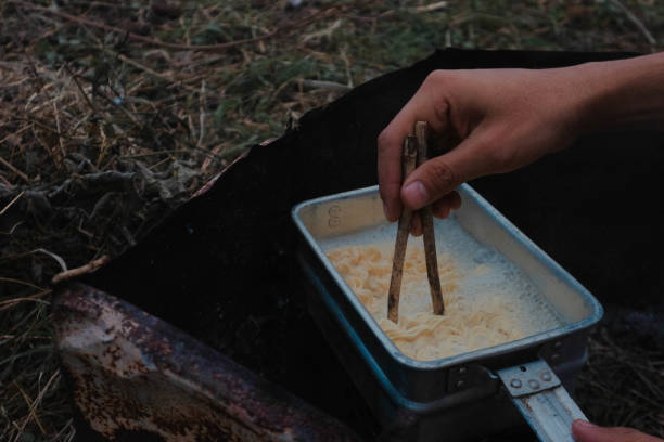 istock Boiling instant noodles in a nest while camping in nature 2155792370