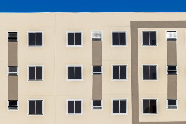 Facade with windows of a lower middle class residential building in Brazil
