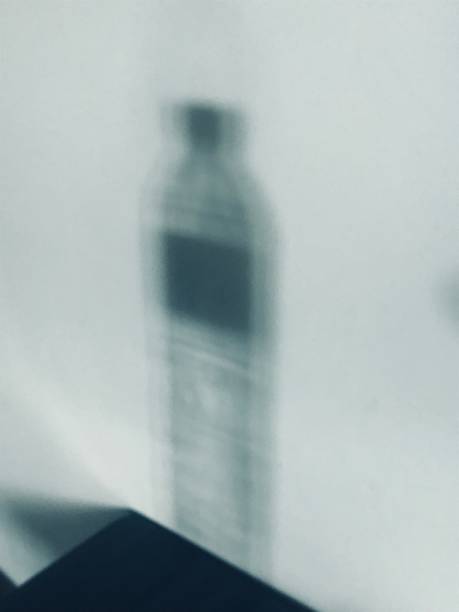 istock Shadow of drinking water bottle on the wall 2155795167
