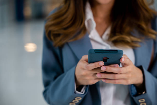 istock Female hands typing message on smartphone 2155795535
