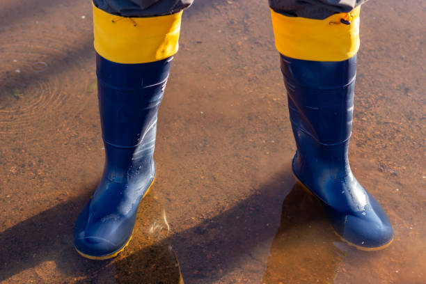 istock Rubber boots safety equipment in suspicious waters 2155803034