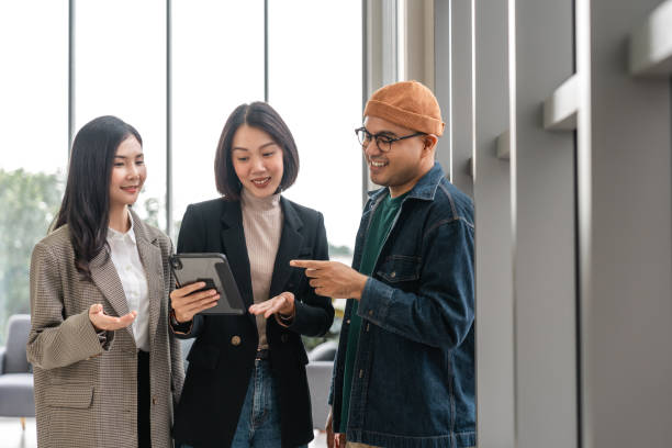 istock Asian business start up freelance people team analyzing statistics financial. Group Team of businesspeople man and woman Meeting Conference Discussion various topic Corporate Concept in office. 2155803605