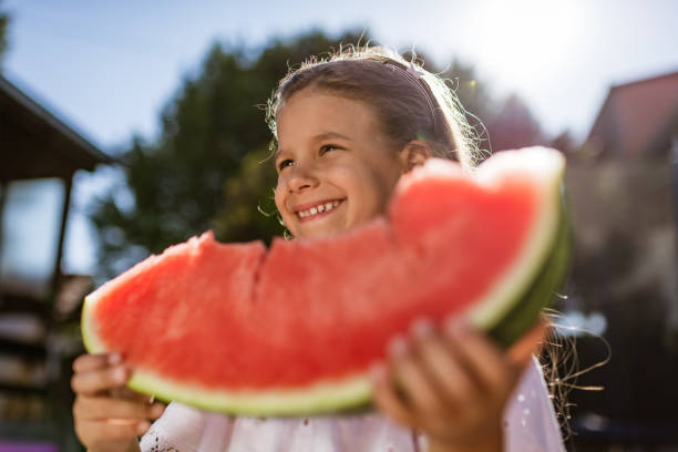 istock Beautiful girl eating watermelon 2155804400