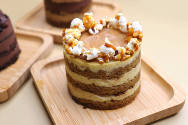 istock Assorted Seasonal mini cakes. Hazelnut, Opera, Salted Caramel, and Double Chocolate. Endless variety, easy serving, moist layers, rich frosting. A symphony of flavor in every bite. Bakery products. 2155804847