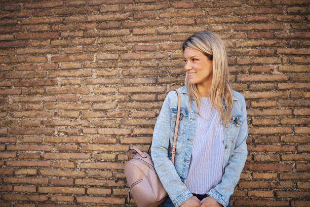 Young female tourist exploring big city.