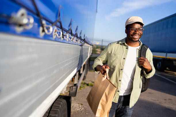 istock Truck driver coming to work and carrying fast food. 2155805895