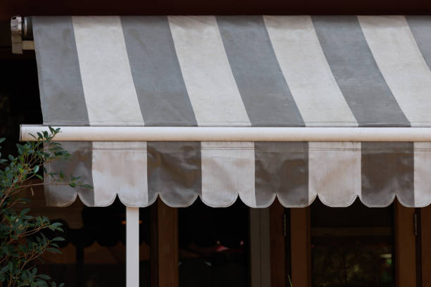 istock A striped awning with a white pipe sticking out of it 2155806805