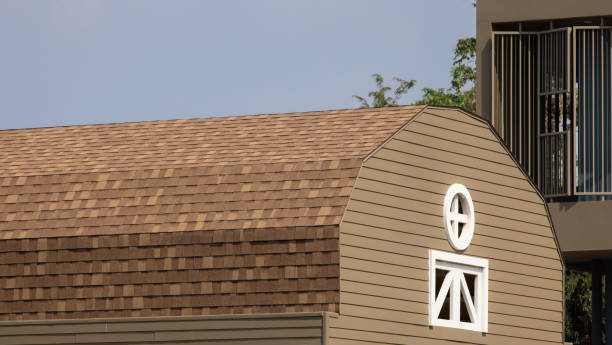 istock A brown and tan barn with a white window. rubber roof shingle. 2155806828