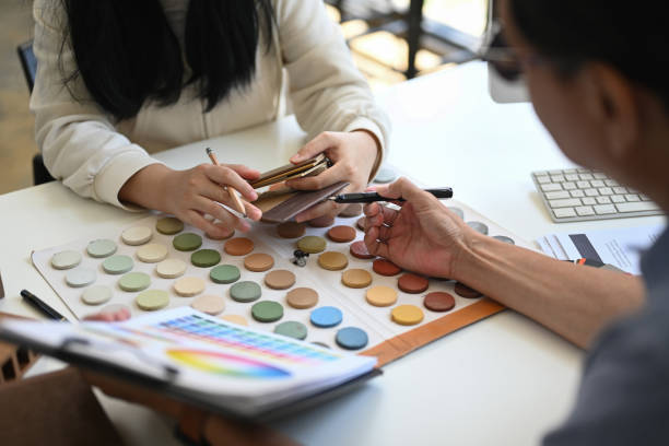 istock Client choosing paint colors for renovation, interior designer consulting client at office 2155806833
