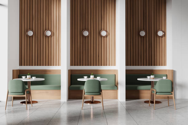 istock Modern cafe interior with green chairs and wooden wall panels, bright lighting, minimalist design concept.  3D Rendering 2155808352