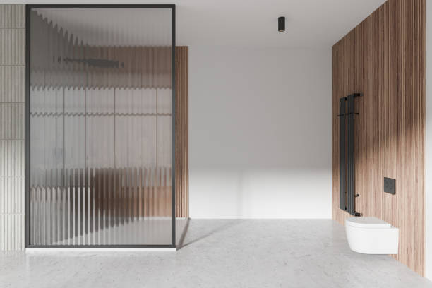 istock Modern hotel bathroom interior with toilet and glass shower, bathing space 2155808671