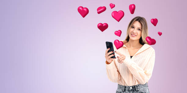 istock A smiling woman looking at her smartphone surrounded by floating 2155808675