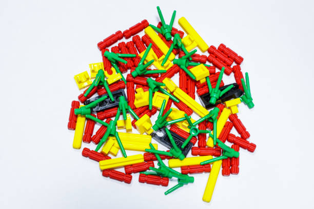 parts of toys Multi-colored brick blocks Isolated, placed on a white background as a backdrop. When assembled, it will form a flower shape.