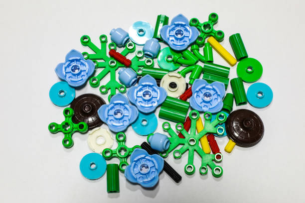 parts of toys Multi-colored brick blocks Isolated, placed on a white background as a backdrop. When assembled, it will form a flower shape.