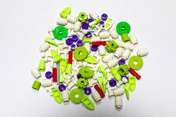 parts of toys Multi-colored brick blocks Isolated, placed on a white background as a backdrop. When assembled, it will form a flower shape.