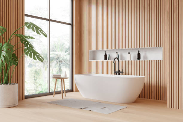 istock Luxury hotel bathroom interior with tub, shelf, plant and panoramic window 2155809244