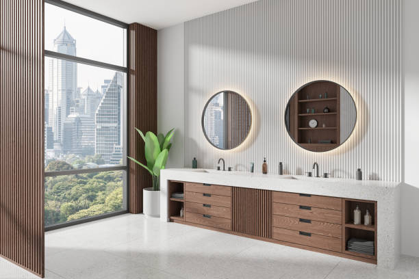 istock Modern hotel bathroom interior with double sink and vanity, panoramic window 2155809315