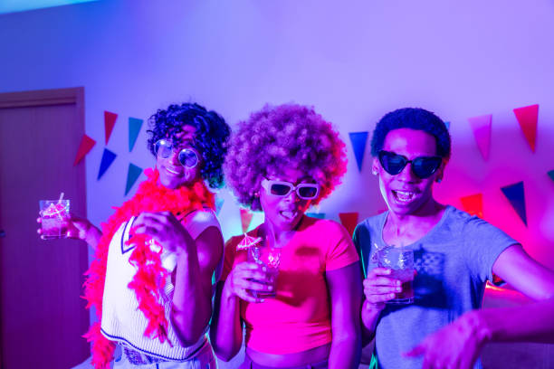 istock Multiracial friends partying at home at night 2155809751