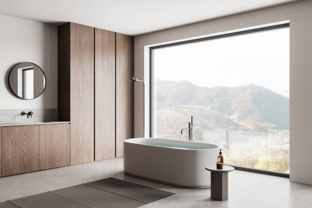 istock Wooden home bathroom interior with tub and sink, panoramic window 2155809895