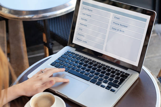 istock woman filling form online, web form to register 2155810840