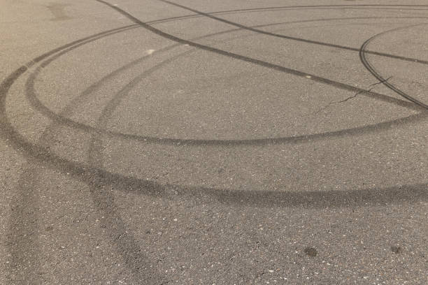 istock tire tracks during dangerous driving on the road 2155817393